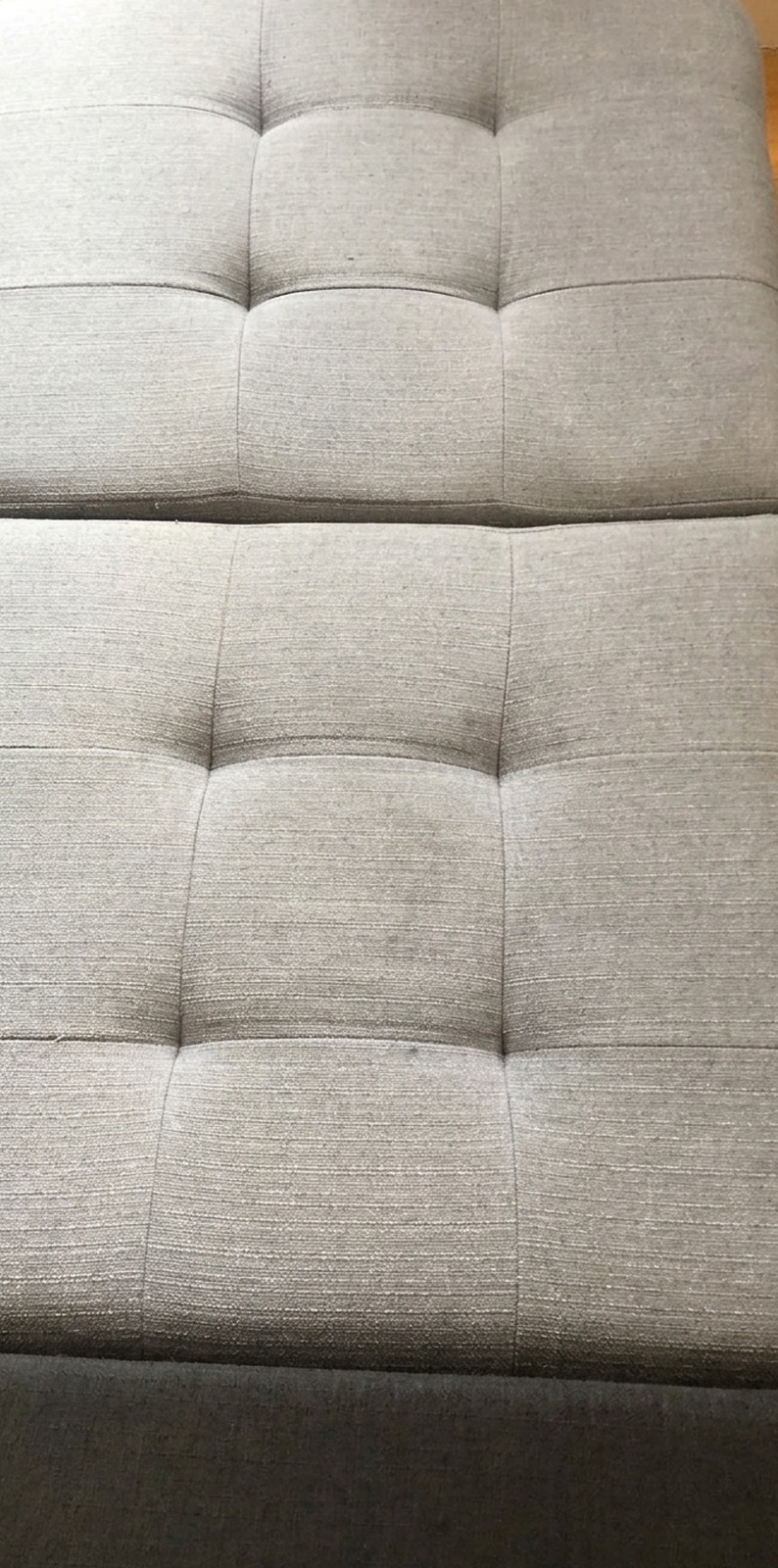 The same ottoman after professional upholstery cleaning