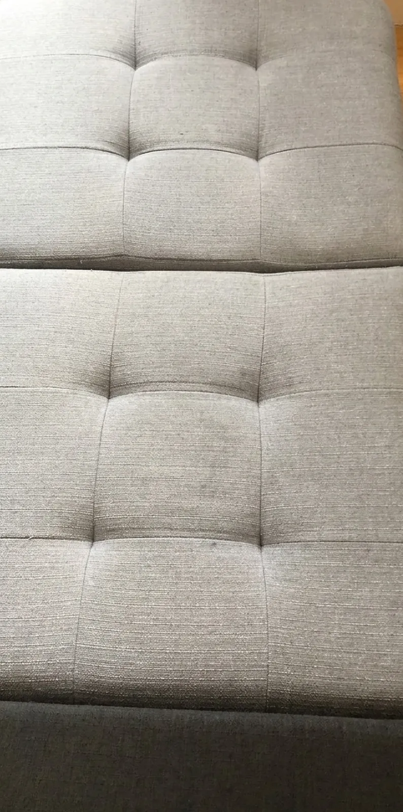 The same ottoman after professional upholstery cleaning